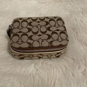 Coach gold logo pill case
